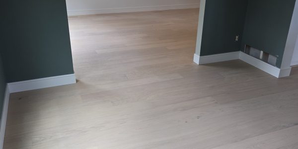 New light oak engineered hardwood floor installed in modern home by Floor & More in Centennial, CO.