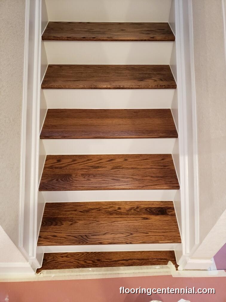 Dark walnut stained hardwood stair treads, professionally refinished