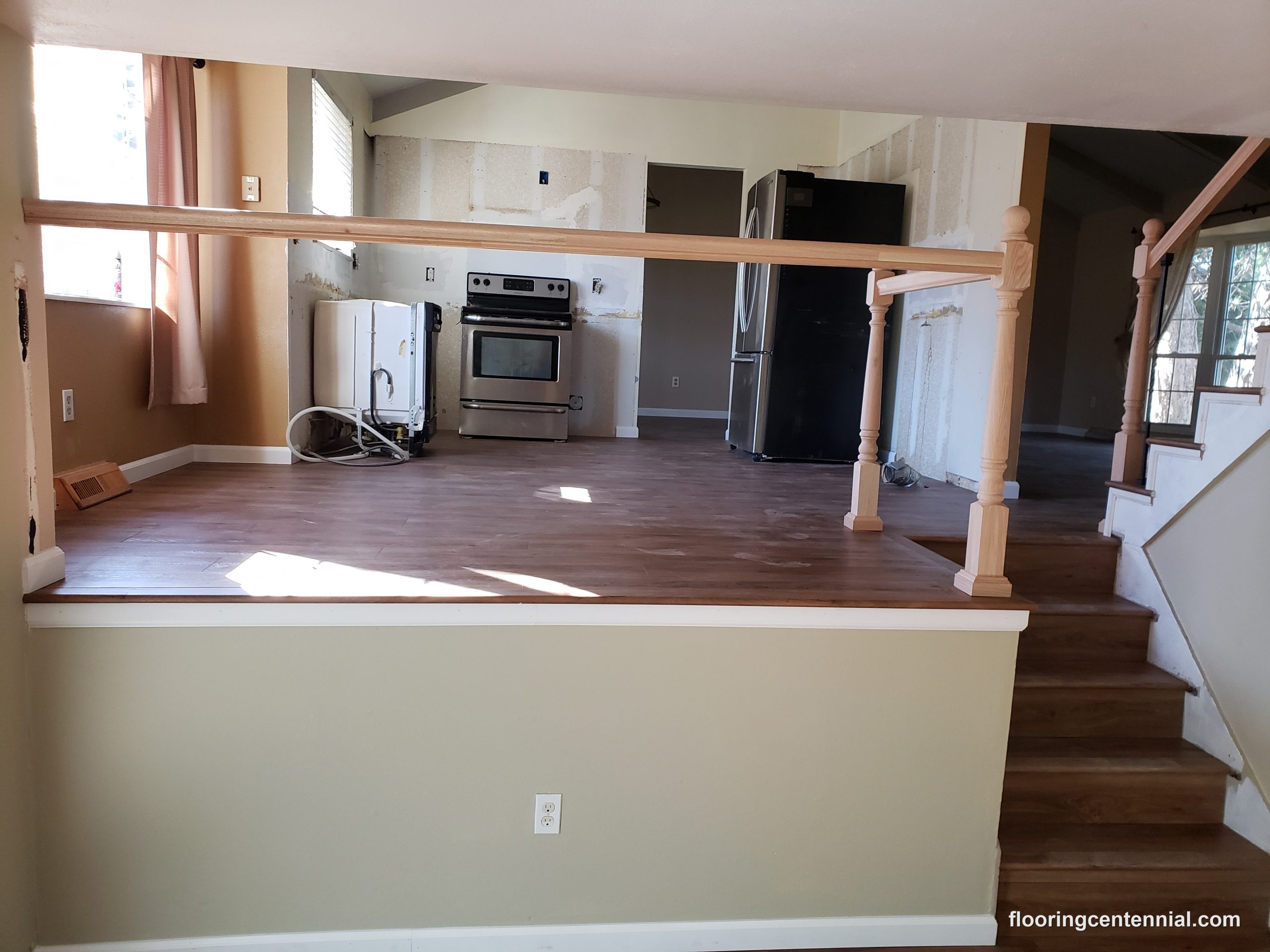Before and after comparison of a hardwood staircase refinish