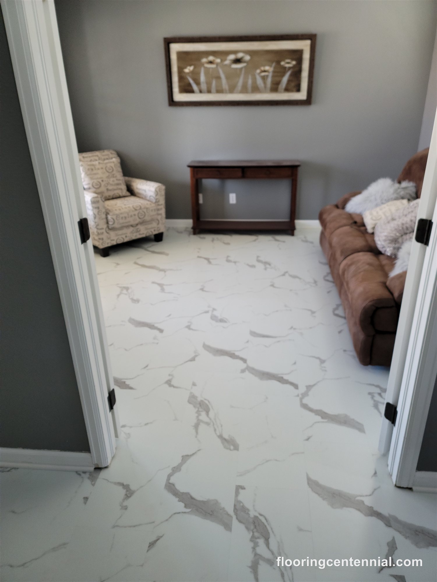 Living room with white marble-look tile flooring