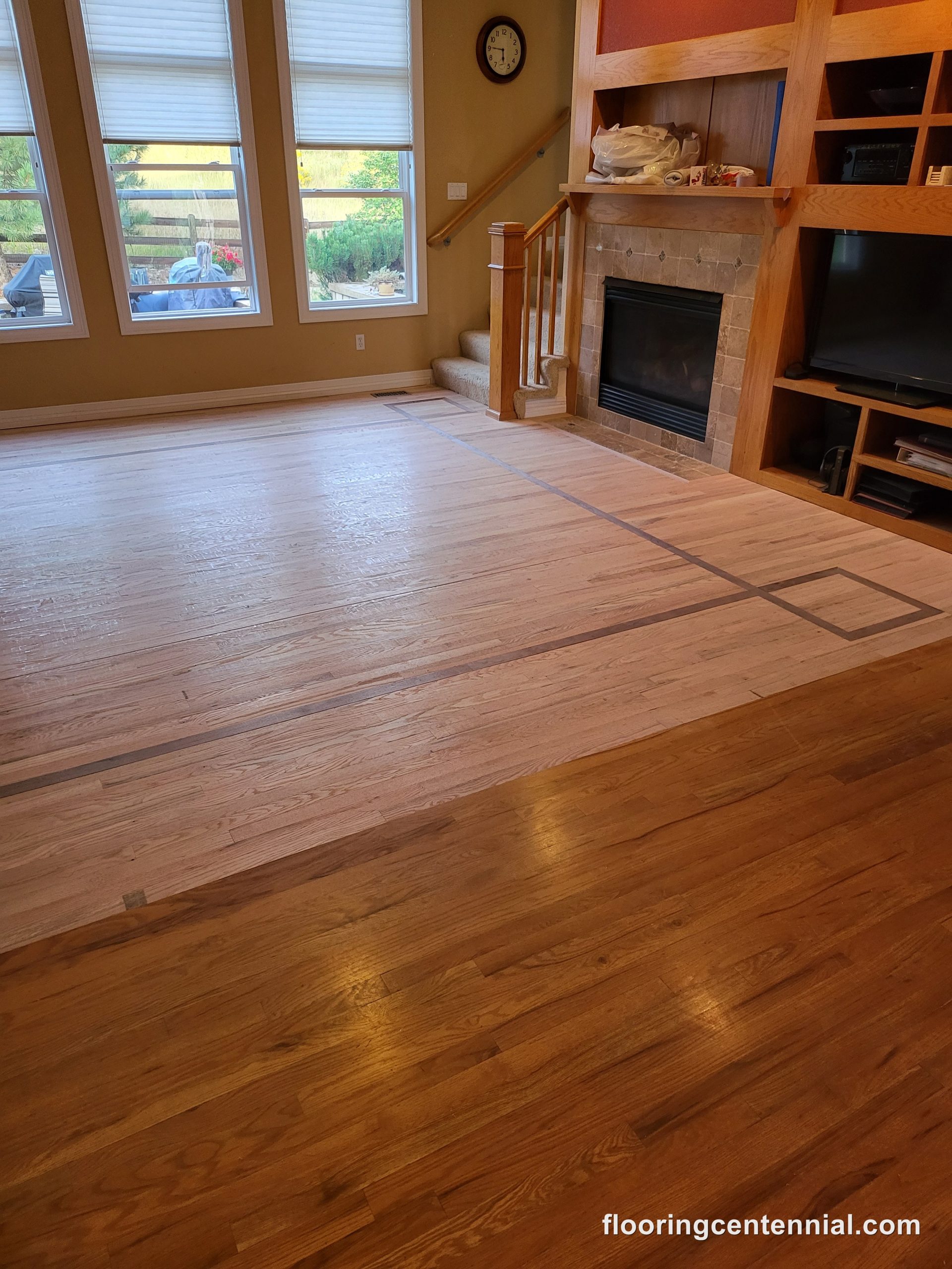 Oak hardwood flooring with a custom decorative inlay border