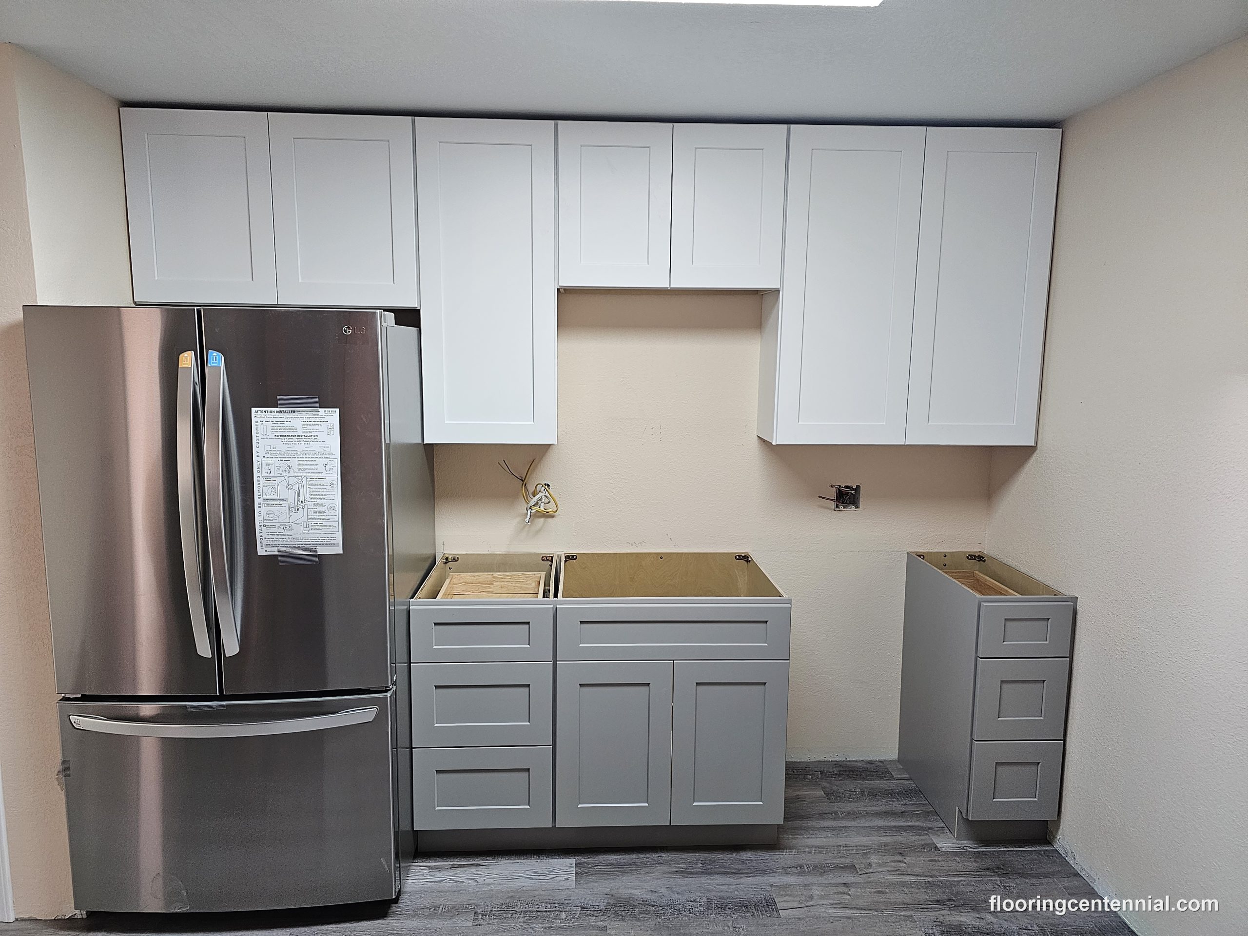 New kitchen cabinets installed and ready for countertops during a remodel