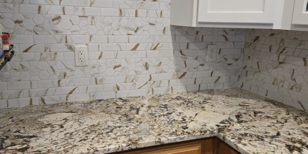 Kitchen backsplash with marble-look subway and hexagon mosaic tile