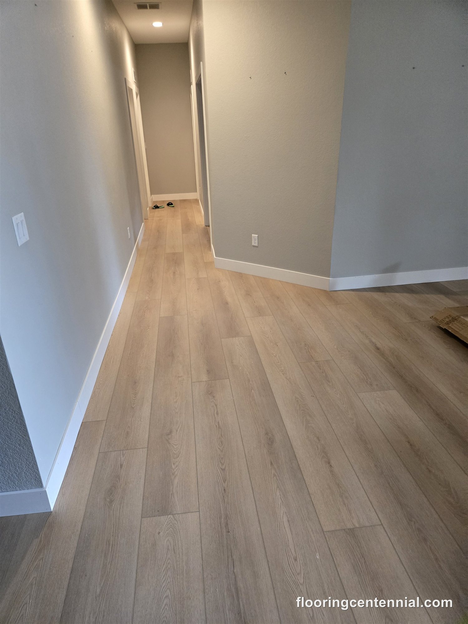 Bright hallway with light wood-look vinyl plank flooring