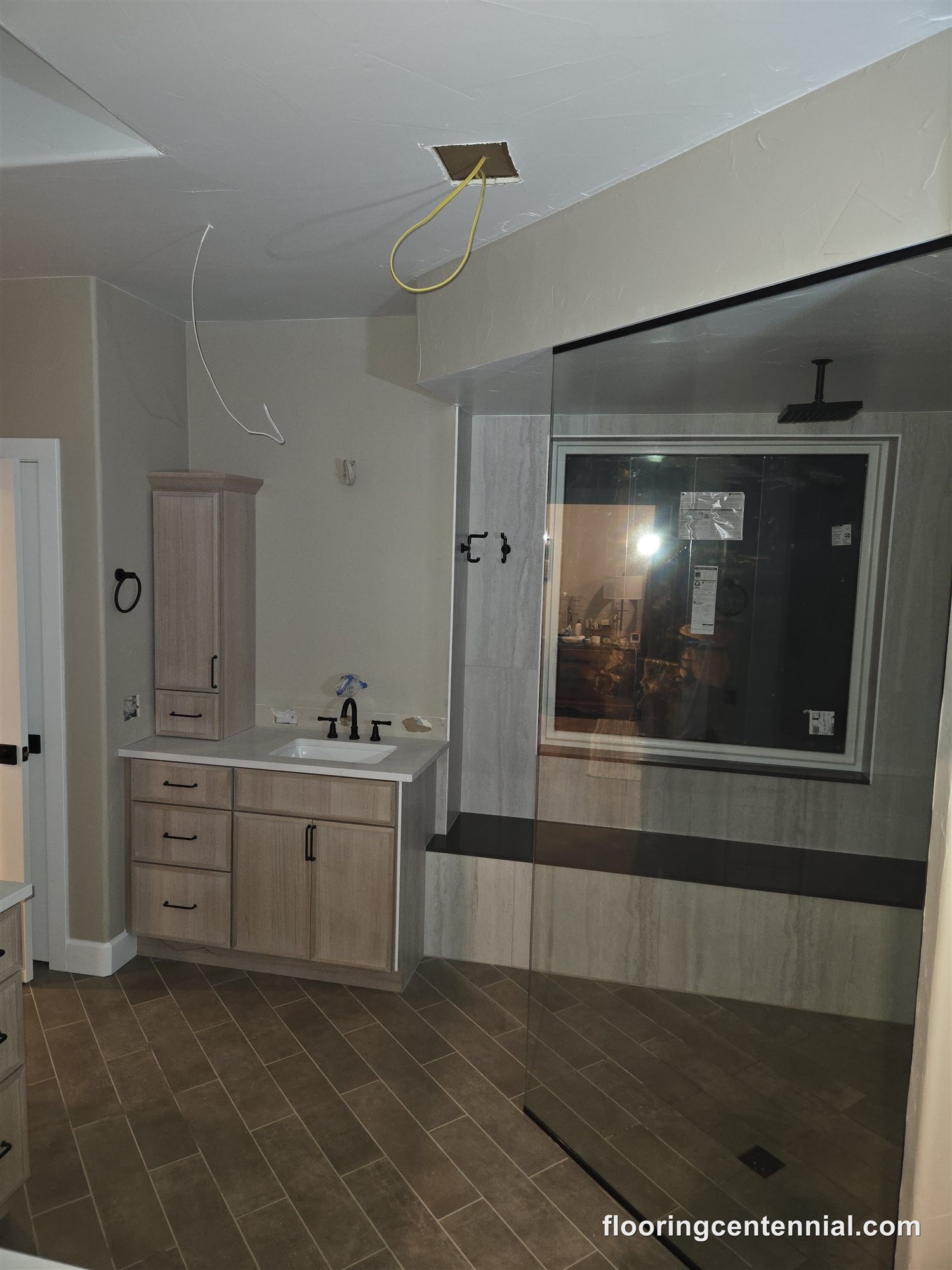 Double vanity and LVP flooring in a remodeled Morrison master bathroom