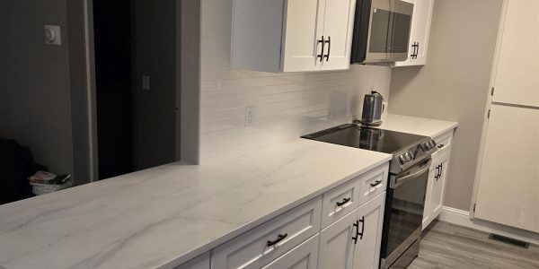 New kitchen cabinets and island with luxury vinyl plank flooring, Aurora CO
