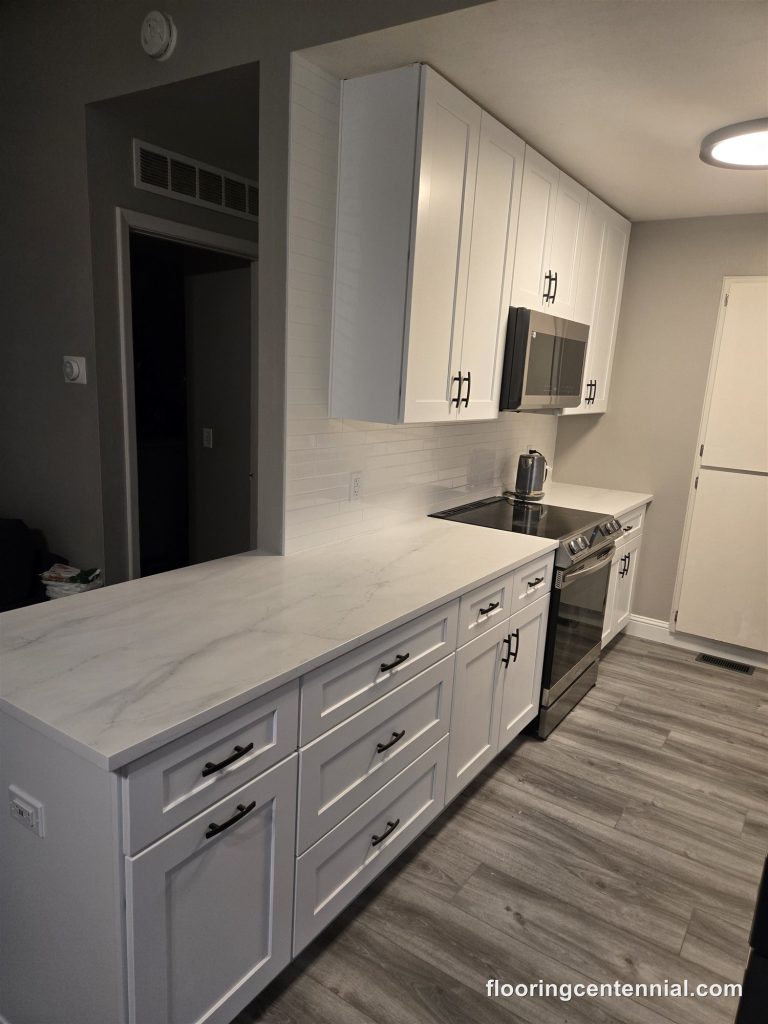 New kitchen cabinets and island with luxury vinyl plank flooring, Aurora CO
