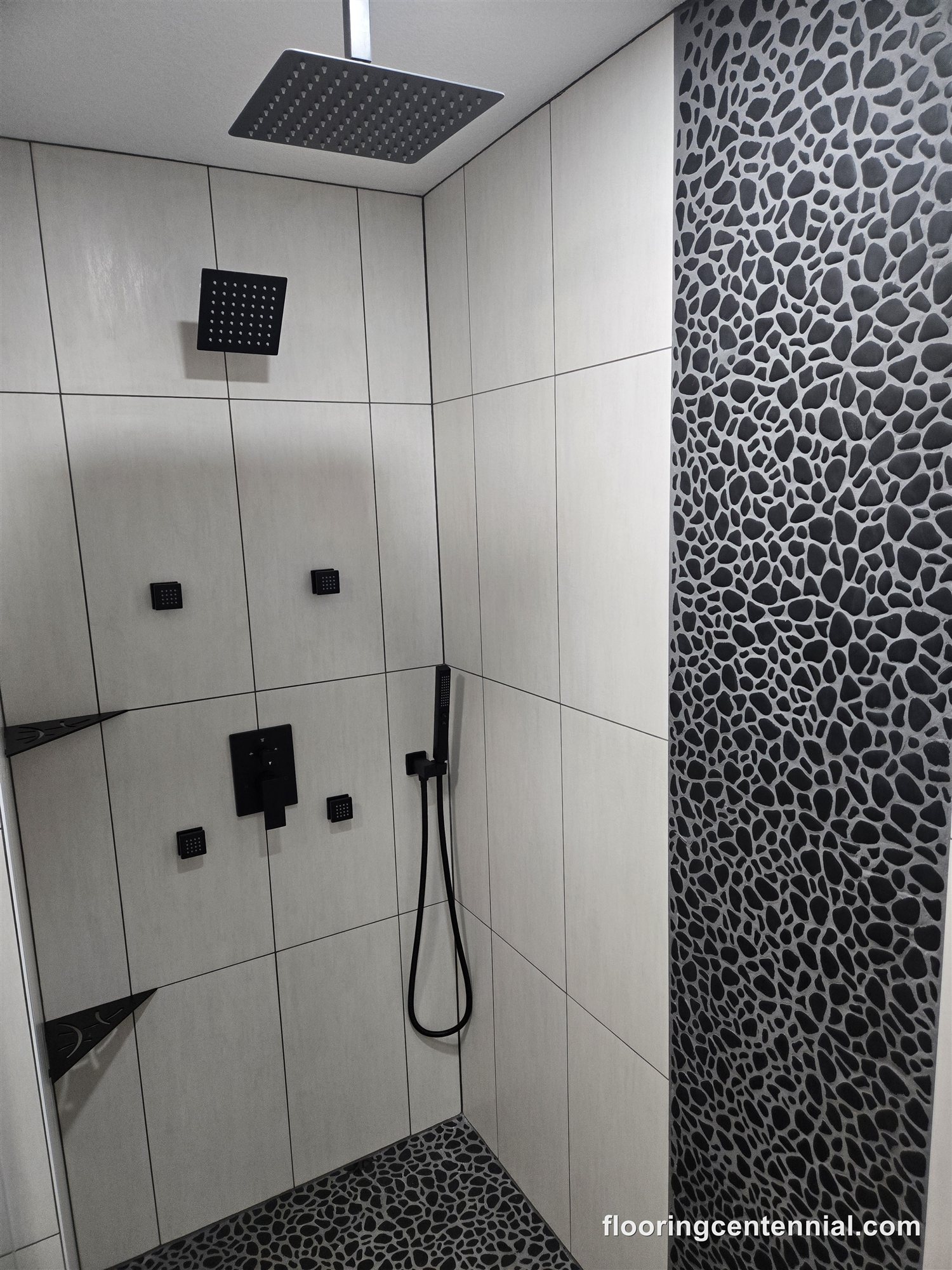 Mosaic tile accent wall in a new basement shower, Aurora CO