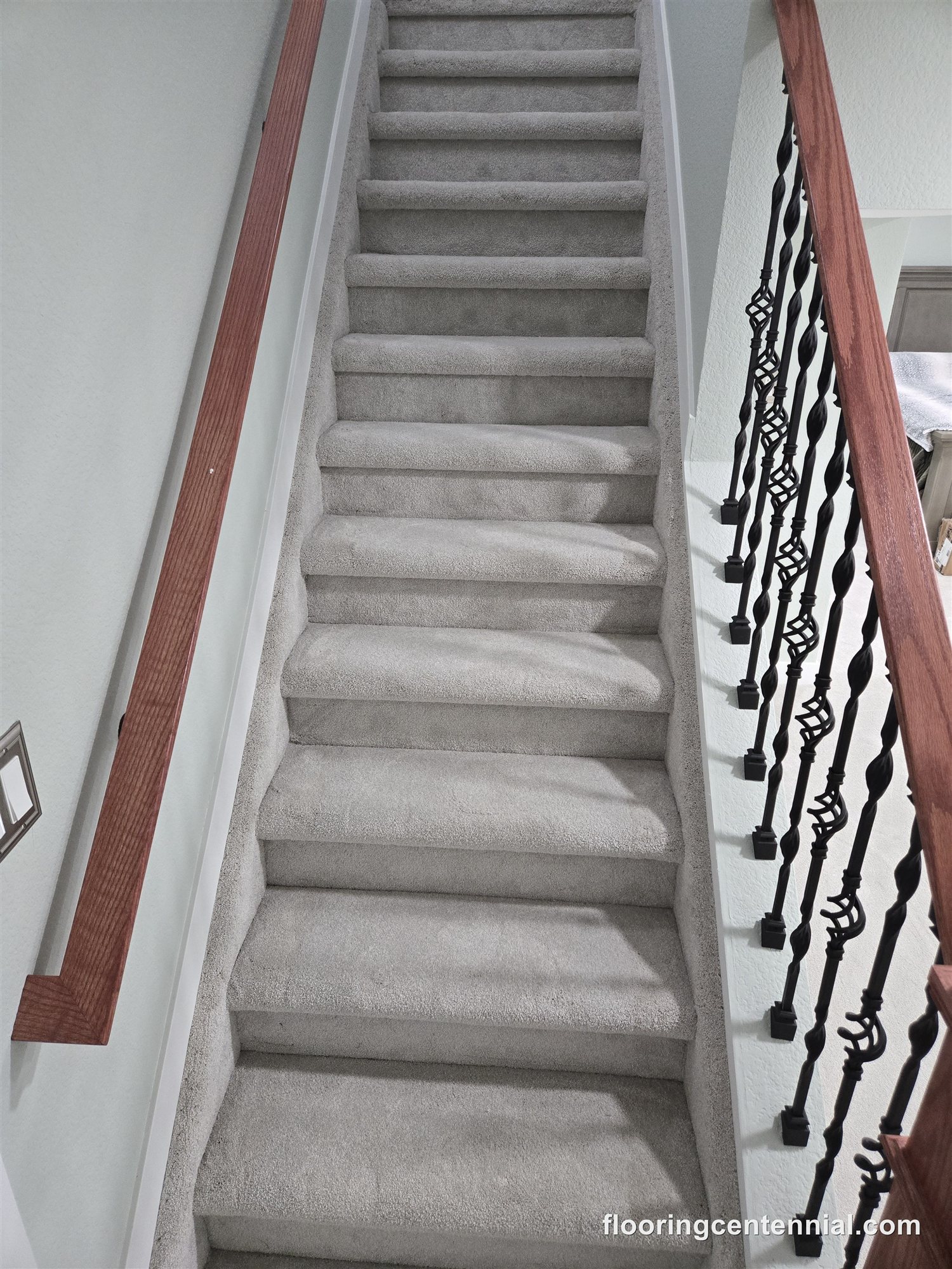 Carpeted staircase with painted railing and new carpet and pad, Aurora CO