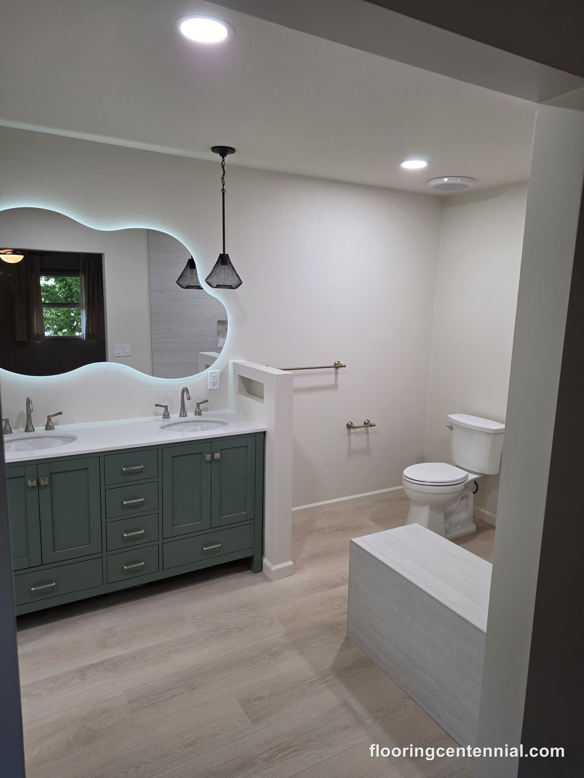 Luxury curbless walk-in shower with rainfall shower head and large-format tile