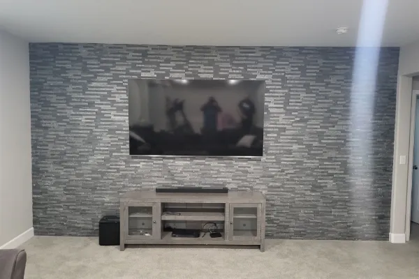 Stacked stone accent wall built by Floor & More